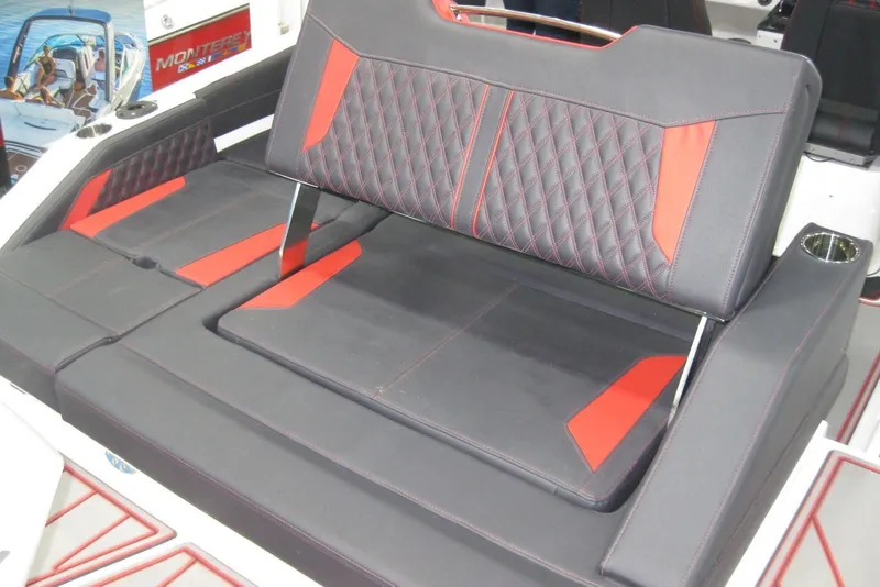 Slide: The Image of 2025 Monterey Elite 27 OB boat interior with sleek seating and modern dashboard. - 9