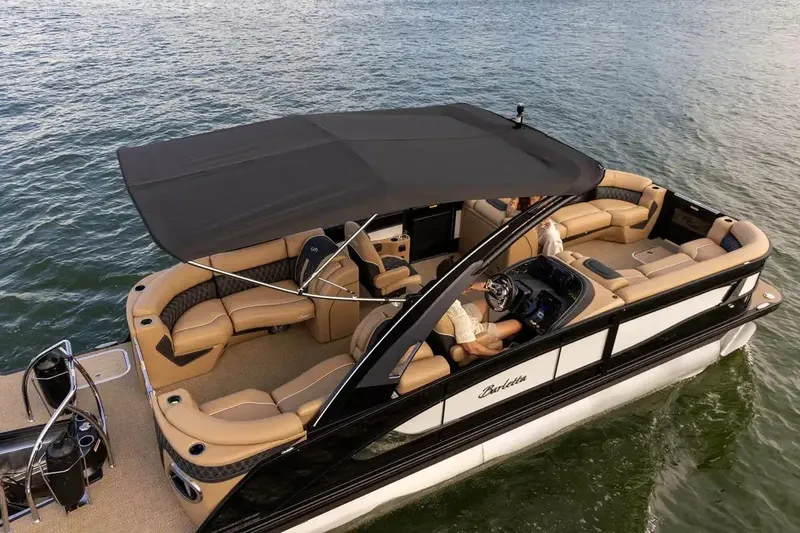 Slide: The Image of Manufacturer Provided Image: 2026 Barletta Lusso 23QCSS pontoon boat on water, featuring luxurious seating and canopy. - 3