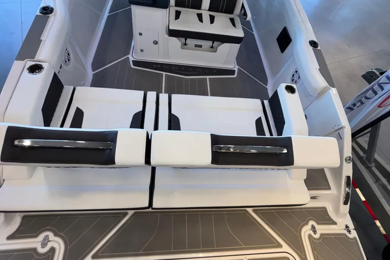 Slide: The Image of 2026 Monterey Elite 30 OB boat interior with sleek seating and modern design. - 12