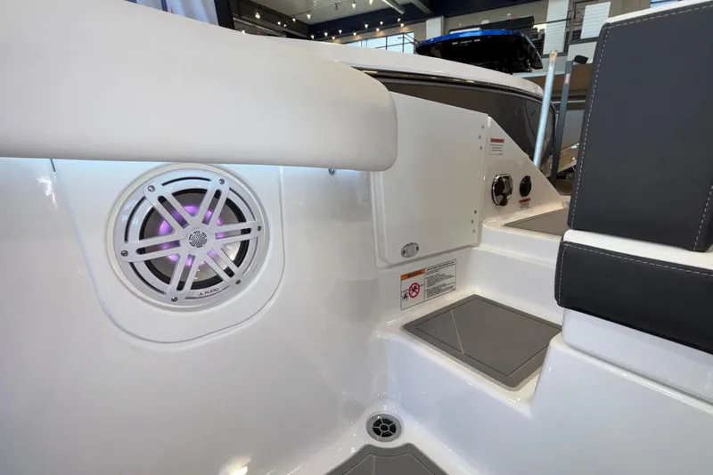 Slide: The Image of 2026 Monterey Elite 30 OB boat interior with speaker and seating area. - 15