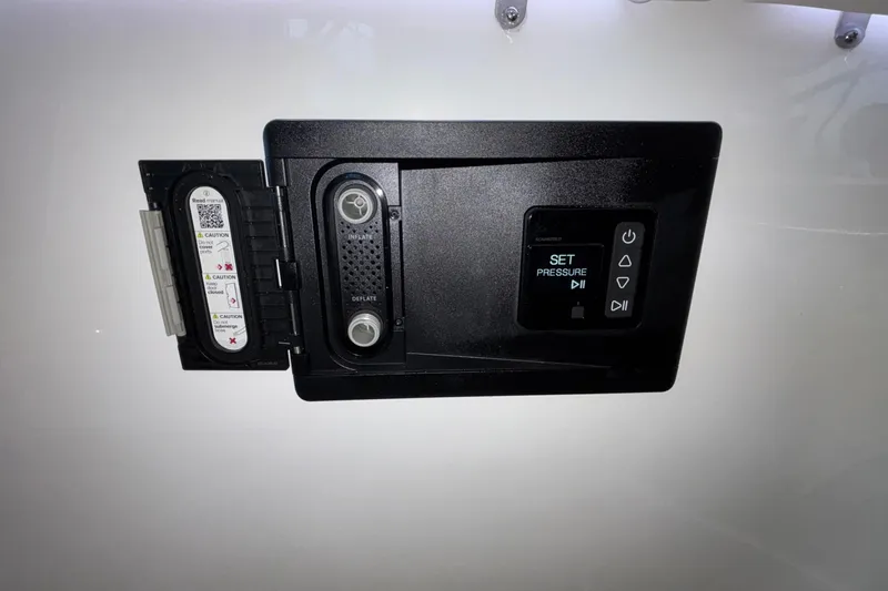 Slide: The Image of Control panel of 2026 Monterey Elite 30 OB boat with pressure settings and caution labels. - 17