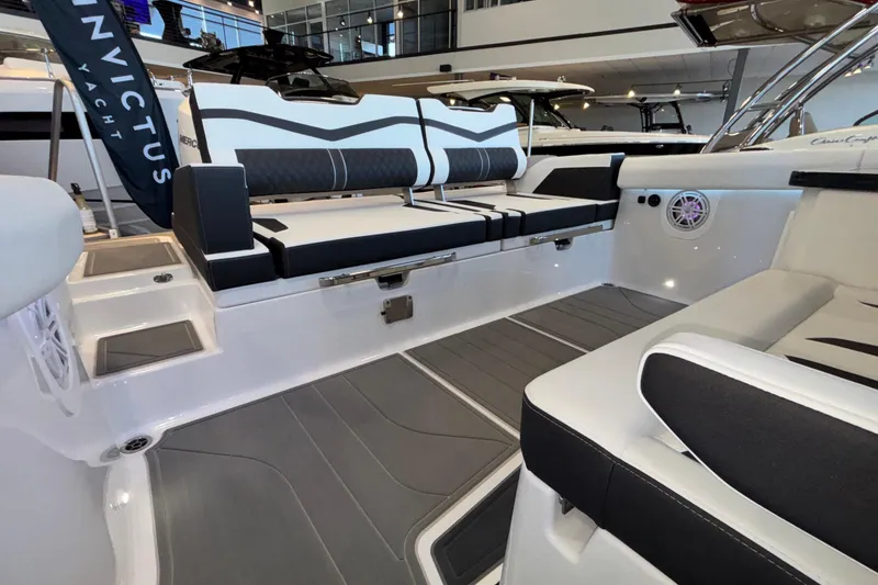 Slide: The Image of 2026 Monterey Elite 30 OB boat interior with sleek seating and modern design. - 18