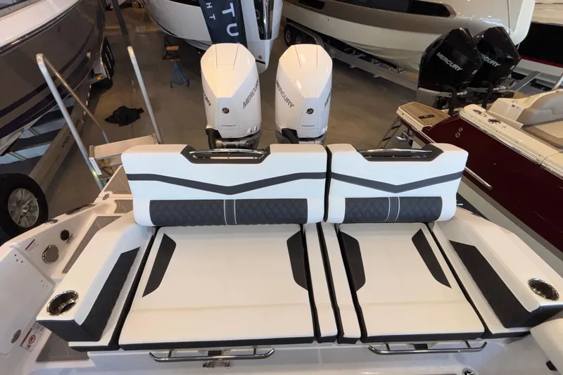 Slide: The Image of 2026 Monterey Elite 30 OB boat with dual Mercury outboard engines and stylish seating. - 19