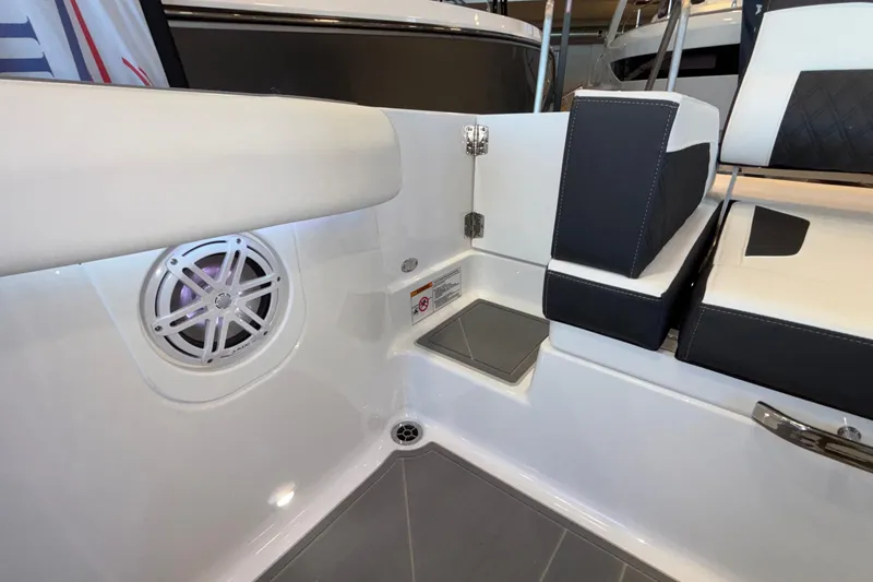 Slide: The Image of 2026 Monterey Elite 30 OB boat interior with speaker and seating area. - 20