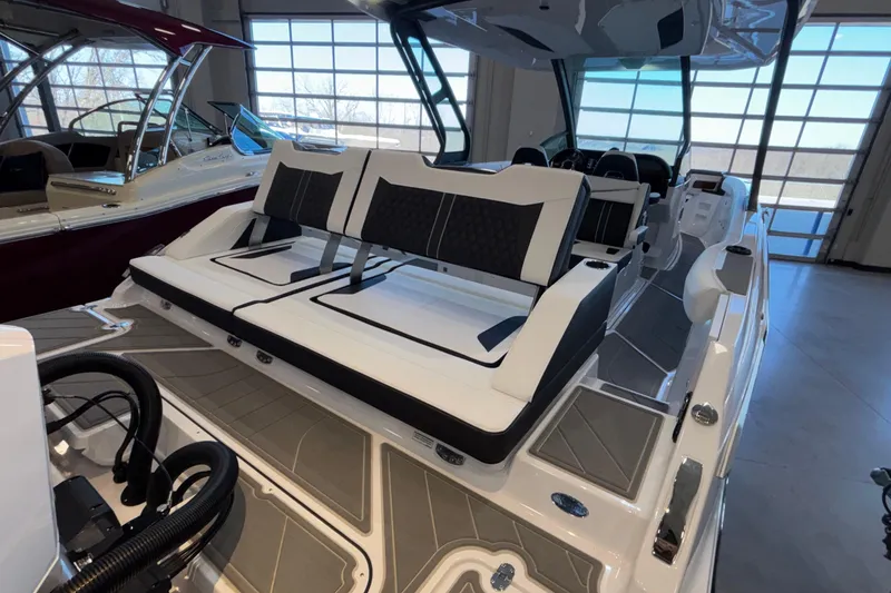 Slide: The Image of 2026 Monterey Elite 30 OB boat interior with sleek seating and modern design. - 21