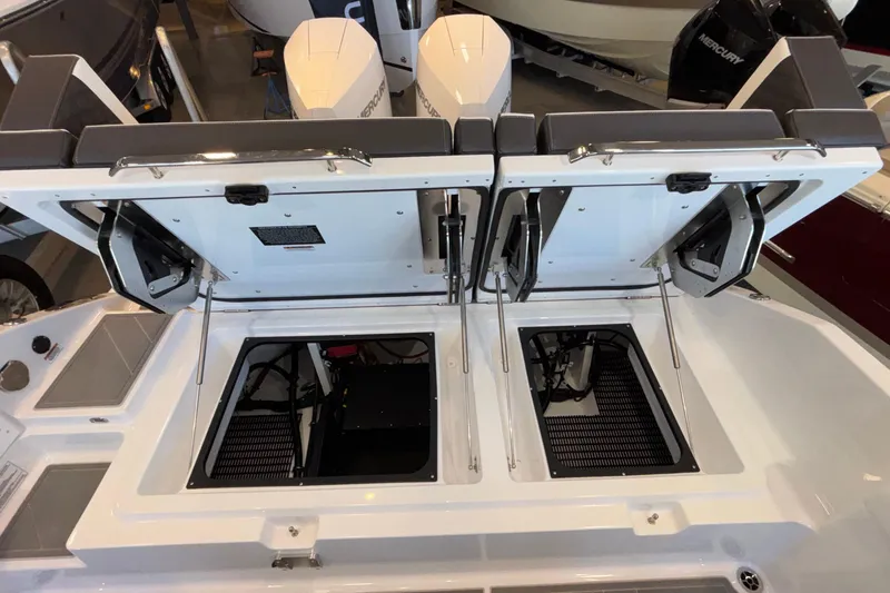 Slide: The Image of 2026 Monterey Elite 30 OB boat with open engine compartments, showcasing dual outboard motors. - 23