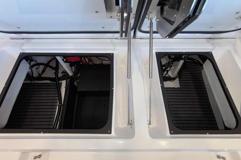 Slide: The Image of Open engine compartments of 2026 Monterey Elite 30 OB boat, showcasing internal components. - 24