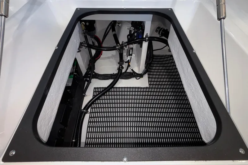 Slide: The Image of Engine compartment of 2026 Monterey Elite 30 OB boat, showcasing wiring and components. - 27