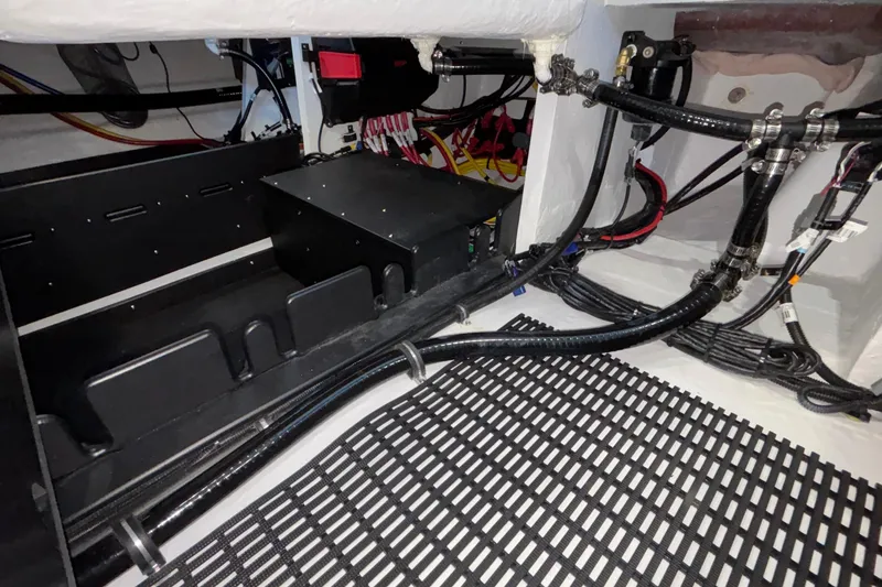 Slide: The Image of Engine compartment of 2026 Monterey Elite 30 OB boat, showcasing wiring and components. - 29