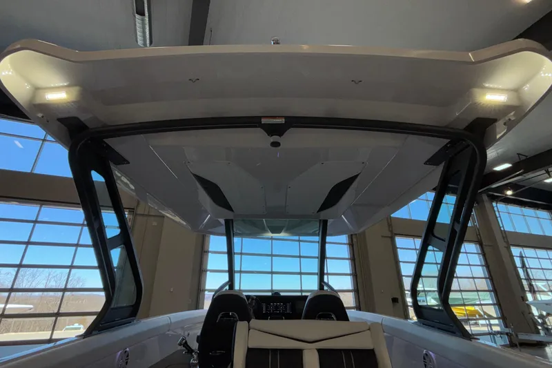 Slide: The Image of 2026 Monterey Elite 30 OB boat interior with modern design and spacious seating. - 32
