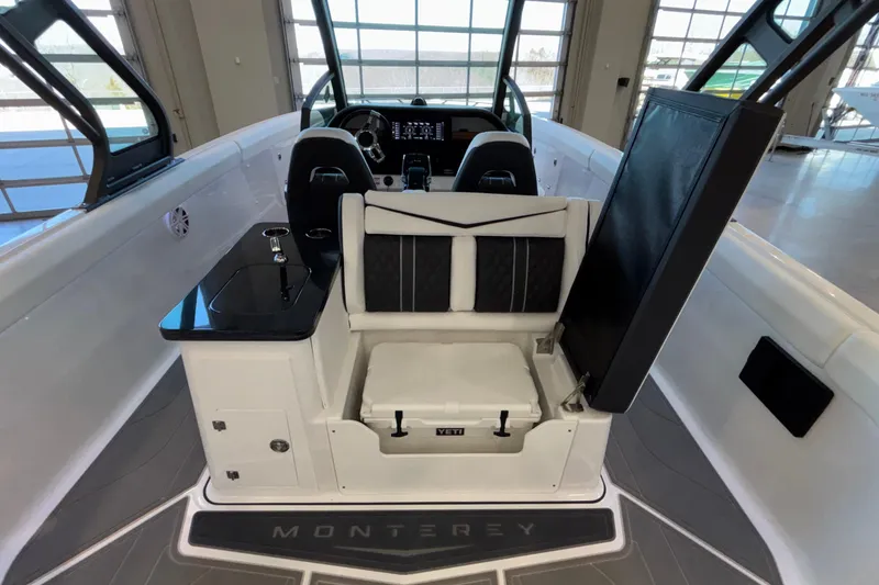 Slide: The Image of 2026 Monterey Elite 30 OB boat interior with seating and storage. - 35