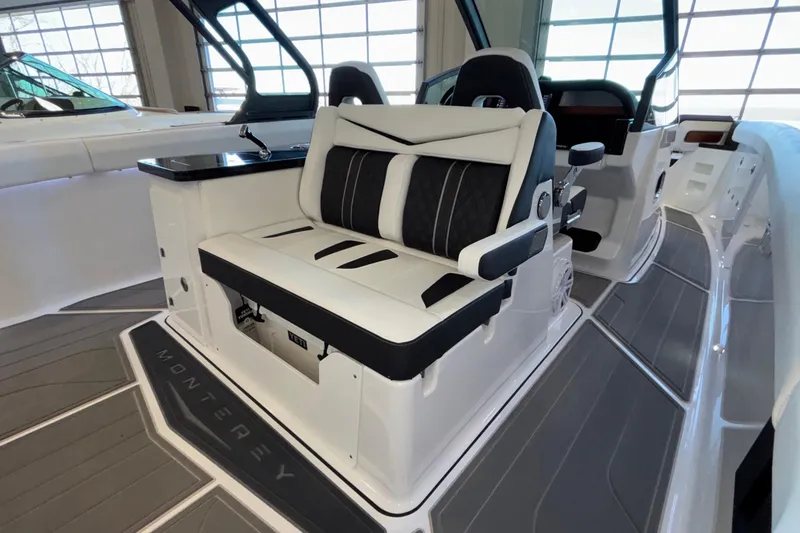Slide: The Image of 2026 Monterey Elite 30 OB boat interior with luxurious seating and modern design. - 36