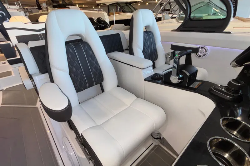 Slide: The Image of Luxury seating in 2026 Monterey Elite 30 OB boat cockpit, featuring modern controls and design. - 39
