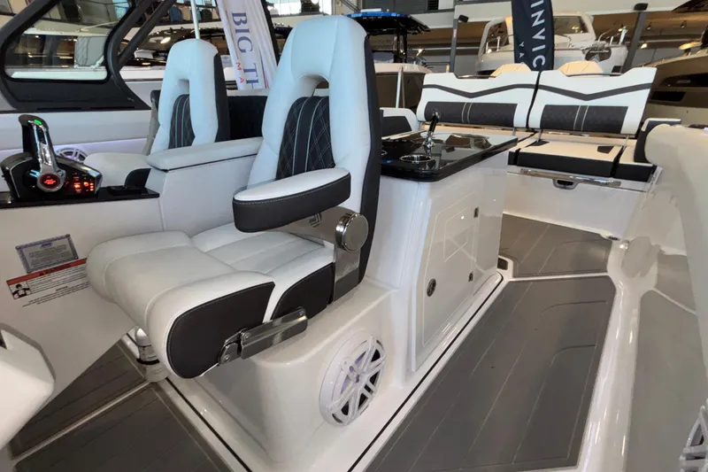 Slide: The Image of 2026 Monterey Elite 30 OB boat interior with luxurious seating and modern controls. - 41
