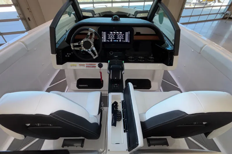 Slide: The Image of Interior view of 2026 Monterey Elite 30 OB boat cockpit with modern controls. - 44