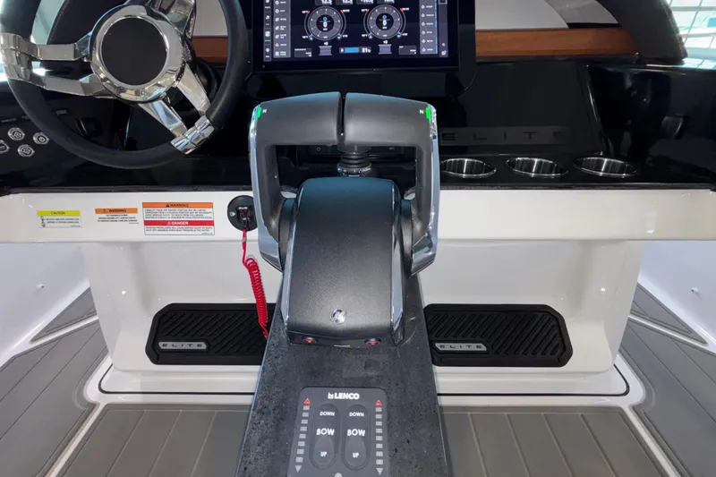 Slide: The Image of 2026 Monterey Elite 30 OB boat helm with steering wheel and control panel. - 46
