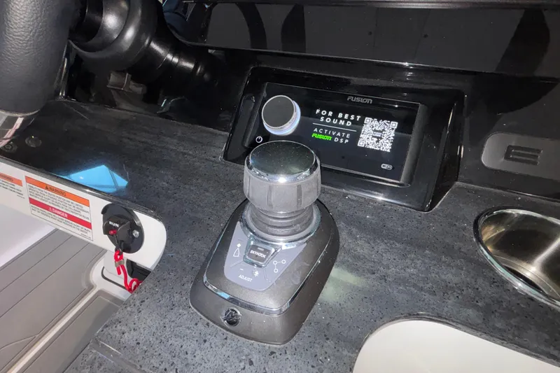 Slide: The Image of Control panel of 2026 Monterey Elite 30 OB boat with joystick and display screen. - 48