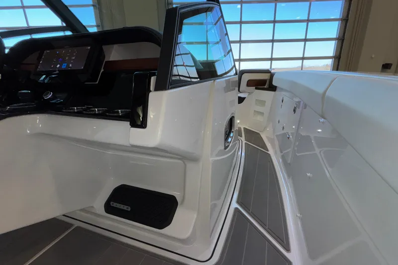 Slide: The Image of 2026 Monterey Elite 30 OB boat interior with sleek design and modern dashboard. - 54