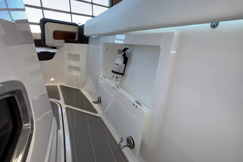 Slide: The Image of Interior view of 2026 Monterey Elite 30 OB boat, featuring sleek design and safety equipment. - 55