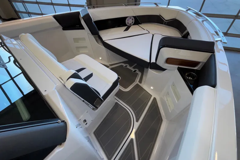 Slide: The Image of 2026 Monterey Elite 30 OB boat interior with sleek seating and modern design. - 57