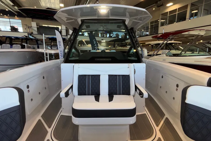 Slide: The Image of 2026 Monterey Elite 30 OB boat interior with modern seating and sleek design. - 59