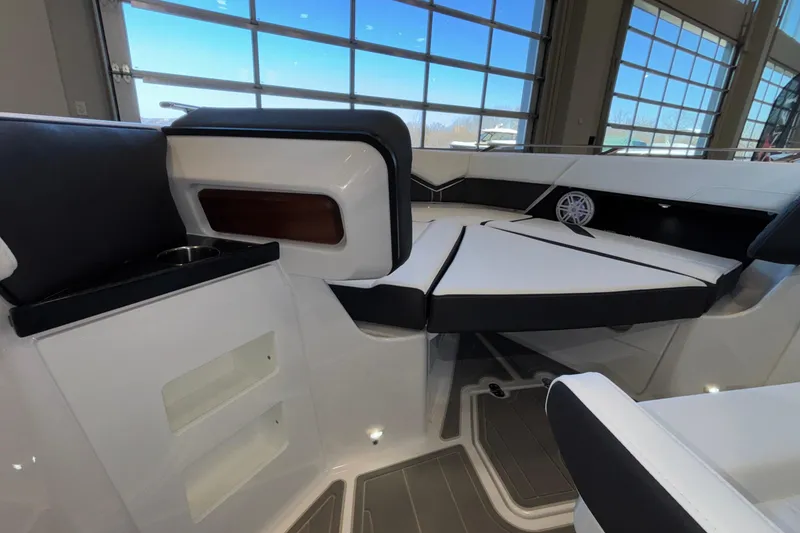 Slide: The Image of Interior of 2026 Monterey Elite 30 OB boat with sleek seating and modern design. - 61