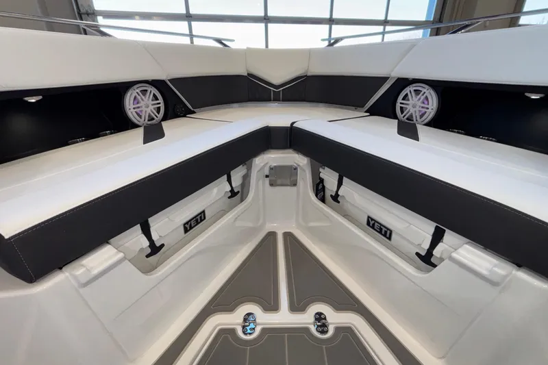 Slide: The Image of Interior of 2026 Monterey Elite 30 OB boat with seating and Yeti cooler storage. - 63