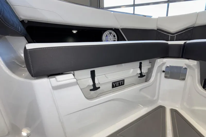 Slide: The Image of Interior of 2026 Monterey Elite 30 OB boat with Yeti cooler storage. - 64