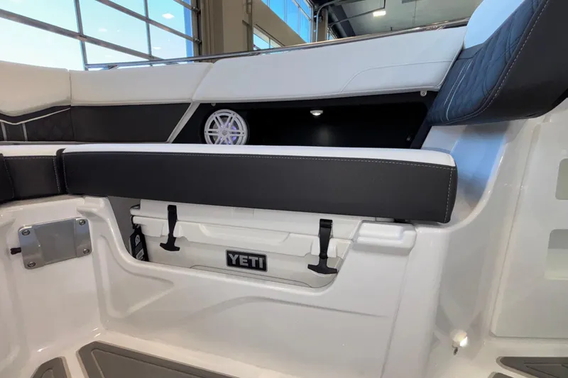 Slide: The Image of Interior of 2026 Monterey Elite 30 OB boat with Yeti cooler storage. - 65
