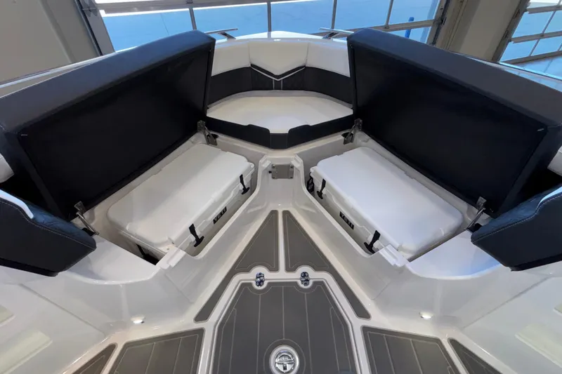 Slide: The Image of Interior view of 2026 Monterey Elite 30 OB boat with seating and storage compartments. - 67