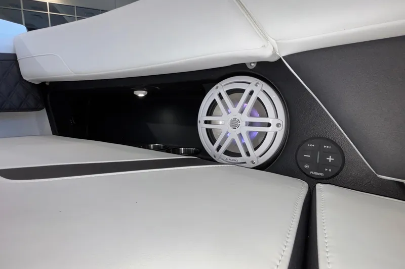 Slide: The Image of 2026 Monterey Elite 30 OB boat interior with JL Audio speaker and Fusion control panel. - 69