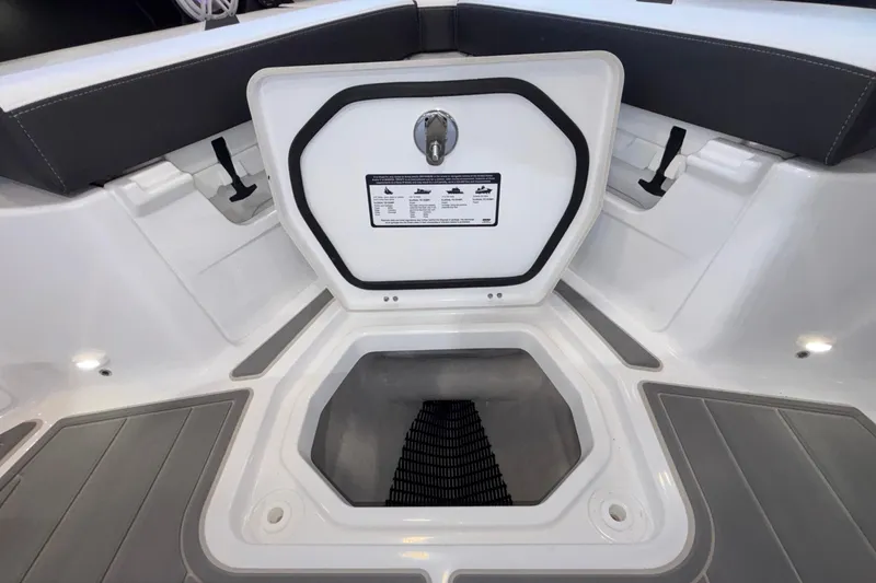 Slide: The Image of Open storage compartment on 2026 Monterey Elite 30 OB boat, featuring sleek interior design. - 71