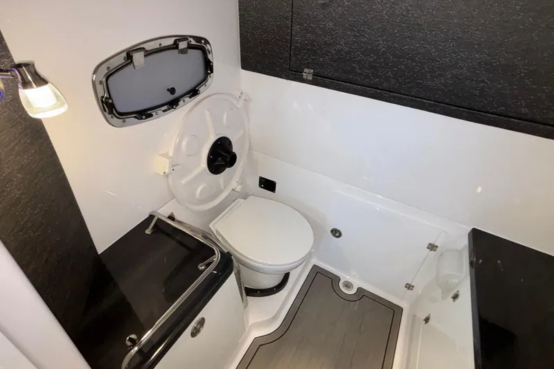 Slide: The Image of Luxurious bathroom in 2026 Monterey Elite 30 OB boat with modern fixtures and sleek design. - 75