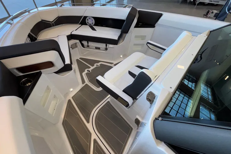 Slide: The Image of Interior of 2026 Monterey Elite 30 OB boat with sleek seating and modern design. - 87