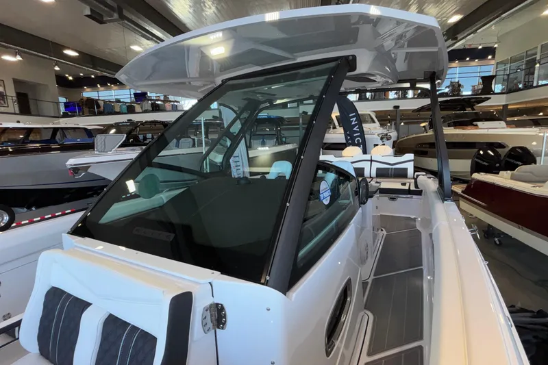 Slide: The Image of 2026 Monterey Elite 30 OB boat interior in showroom, featuring sleek design and modern amenities. - 89