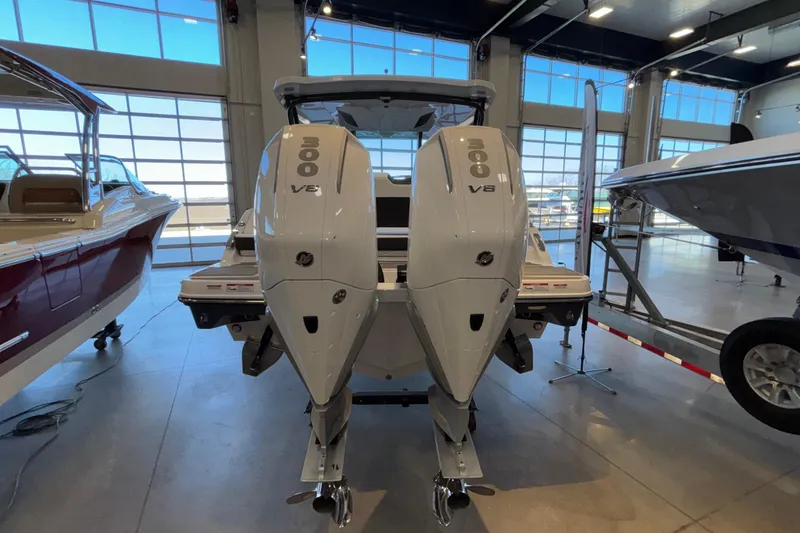 Slide: The Image of 2026 Monterey Elite 30 OB boat with dual 300 V8 engines in showroom. - 9
