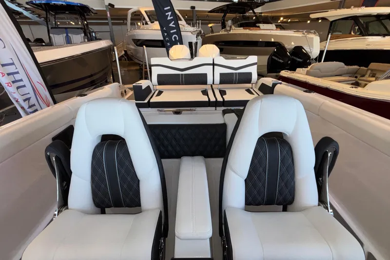 Slide: The Image of Interior of 2026 Monterey Elite 30 OB boat with luxurious seating and modern design. - 93