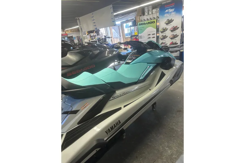 Slide: The Image of 2025 Yamaha WaveRunner FX Cruiser HO in showroom, featuring sleek design and vibrant colors. - 10