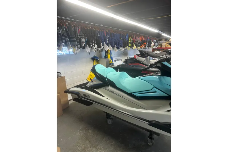 Slide: The Image of 2025 Yamaha WaveRunner FX Cruiser HO in showroom with life jackets displayed above. - 7