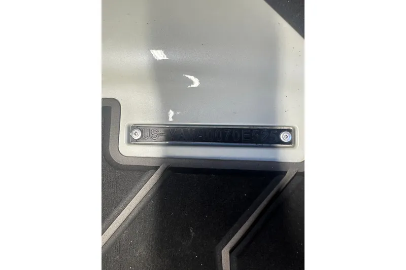 Slide: The Image of 2025 Yamaha WaveRunner FX Cruiser HO identification plate on a gray surface. - 9