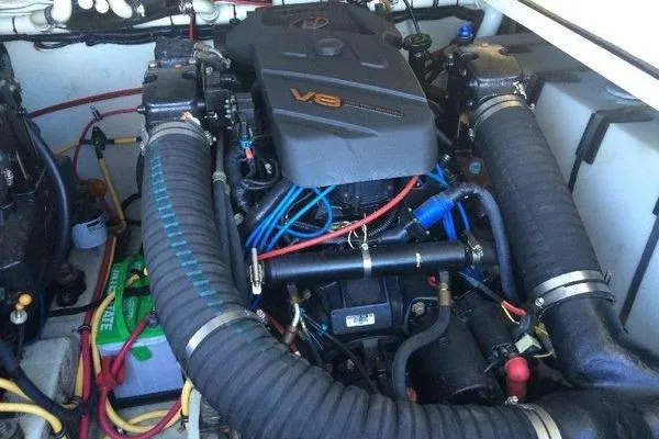 Slide: The Image of 2001 Pursuit 3000 Express V8 engine with visible wiring and components. - 14