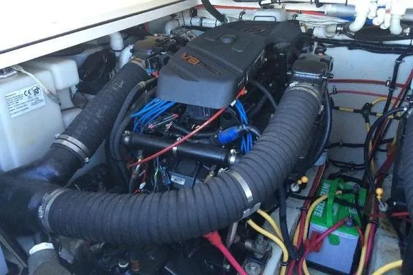 Slide: The Image of Engine compartment of a 2001 Pursuit 3000 Express boat, featuring a V8 engine. - 15