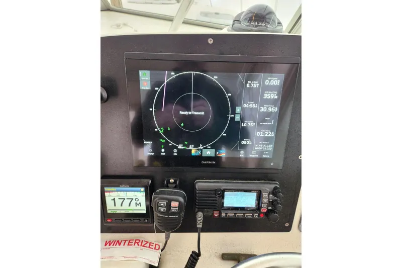 Slide: The Image of Control panel of a 2001 Pursuit 3000 Express boat with Garmin navigation system. - 5