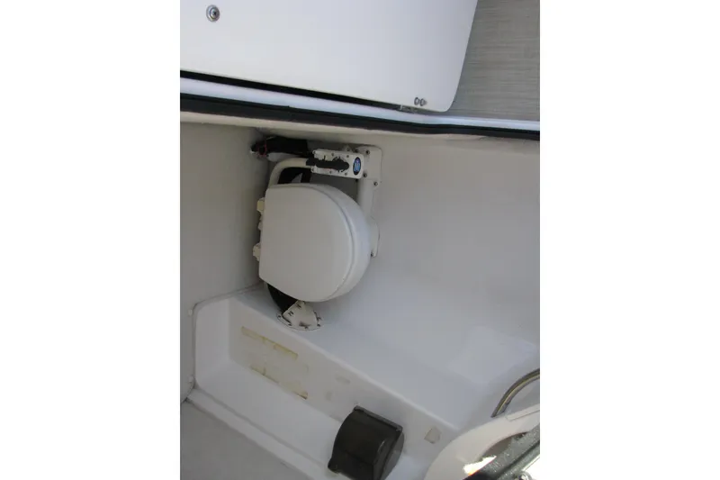 Slide: The Image of 2004 Chaparral 260 SSi boat interior with compact marine toilet. - 10
