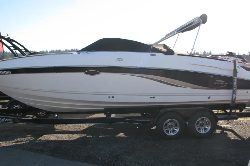 Slide: The Image of 2004 Chaparral 260 SSi boat on trailer, side view, outdoors. - 3