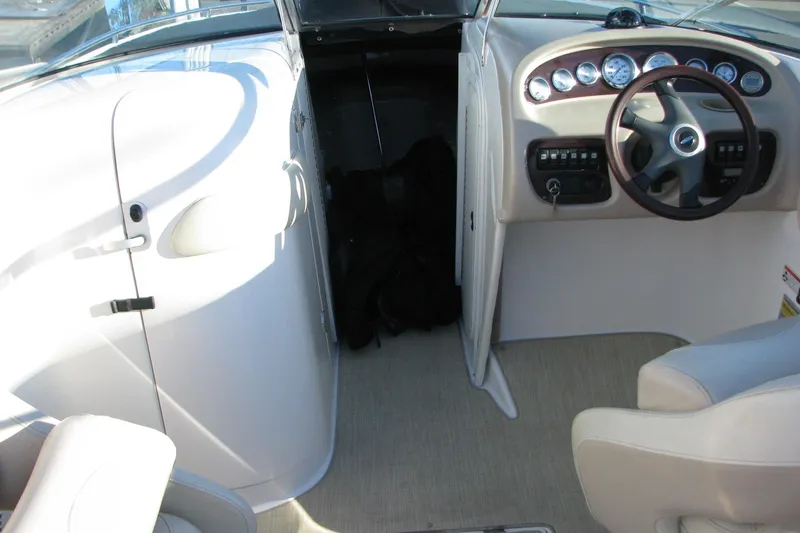 Slide: The Image of 2004 Chaparral 260 SSi boat interior with steering wheel and dashboard controls. - 5