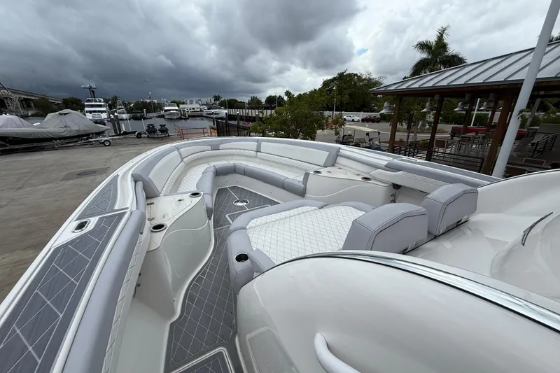 Slide: The Image of 2021 Fountain 43 NX boat cruising on clear blue water near a city skyline. - 22