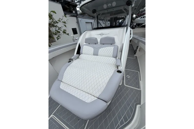Slide: The Image of Luxury 2021 Fountain 43 NX boat interior with plush seating and powerful engines. - 33