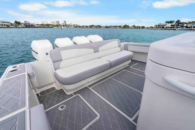 Slide: The Image of 2021 Fountain 43 NX boat with luxurious seating and powerful engines on a scenic waterfront. - 39