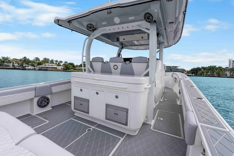 Slide: The Image of 2021 Fountain 43 NX boat interior with sleek design and modern amenities on calm water. - 43
